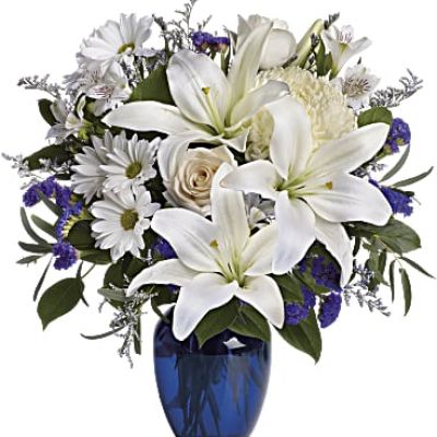 <div class="m-pdp-tabs-description">
<div id="mark-1" class="m-pdp-tabs-marketing-description">In this arrangement, the serenity of the color blue along with the purity of intention symbolized by white will express your feelings wonderfully.</div>
</div>
<p id="arrngDescp">Beautiful blooms such as blue hydrangea, crème roses, white lilies and alstroemeria along with yellow and white chrysanthemums, eucalyptus, limonium and more are beautifully arranged in a dazzling blue vase.</p>